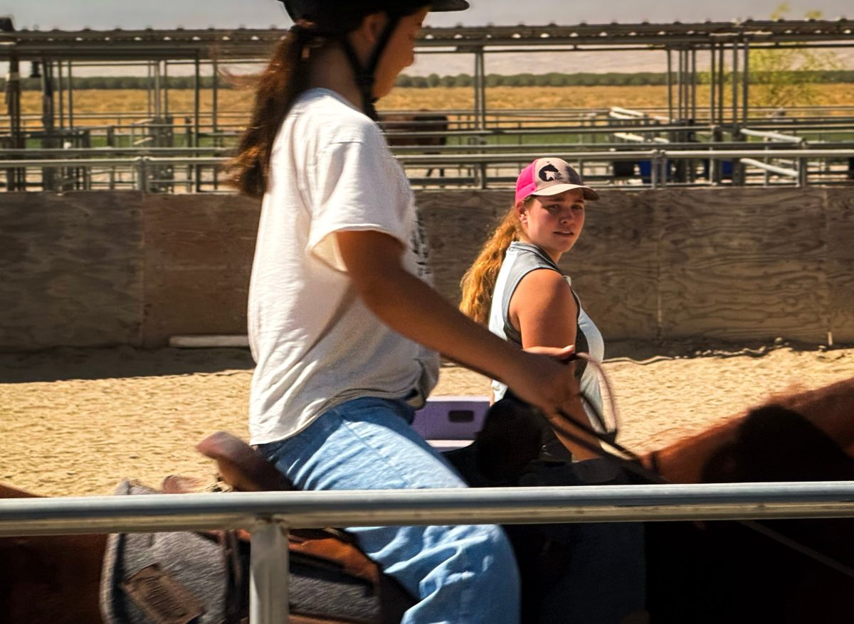 Grace Webb giving a riding lesson at Libben Horsemanship Academy, Bakersfield CA
